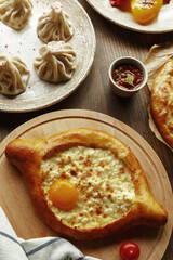 dishes and snacks of traditional Caucasian Georgian cuisine. classic national serving on a rustic wooden table