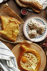 dishes and snacks of traditional Caucasian Georgian cuisine. classic national serving on a rustic wooden table