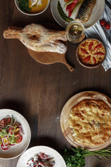dishes and snacks of traditional Caucasian Georgian cuisine. classic national serving on a rustic wooden table