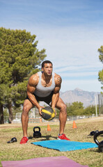 Male Exercising with Medicine Ball