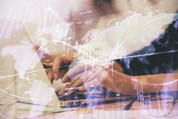 Multi exposure of woman hands typing on computer and financial graph hologram drawing. Stock market analysis concept.