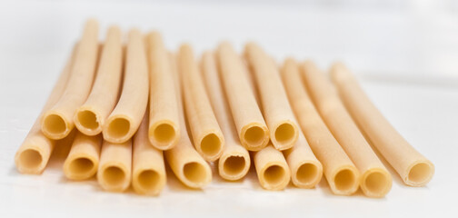 pasta straw on white table