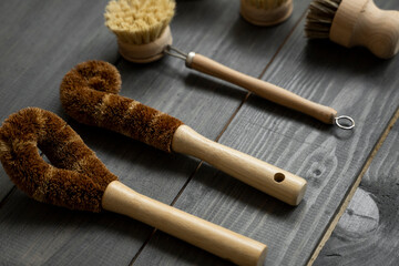 Set of brushes for eco-cleaning the home, washing dishes and surfaces without chemicals and plastic. Zero waste kitchen cleaning concept. Eco friendly natural cleaning bamboo dish brushes.