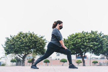 Woman working out stretching exercises