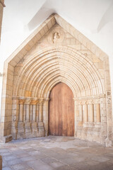 large entrance door to the church with large arches