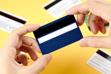 person holding at his hand blank debit or credit card. template for design. solvency concept