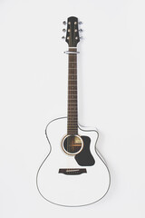 Elegant white acoustic guitar on white background 
