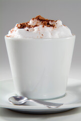cup of cappuccino with whipped cream