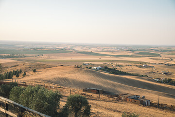 Obraz premium steppe landscape with the image of wide fields and the city. Mountain landscape in Portugal