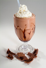 chocolate milkshake with cream and pieces of chocolate