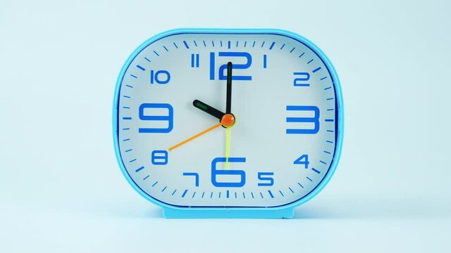 Blue Alarm clock  isolated on white background Time lapse 45 minutes. 