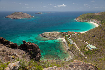 Obraz premium The beautiful blue and green coast of a tropical island from a high viewpoint.