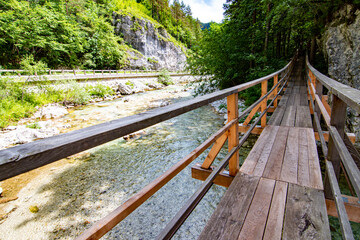 Wooden bridge over the river in Robanov Kot, Slovenia © Miroslav