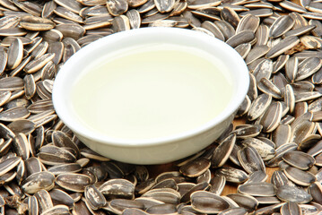 organic sunflower oil in a bowl and some seed
