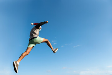 oung man jumping. Parkour at Christmas in the urban space. Sport in the city. Outdoor sports activities. Stunts.
Latin man. Argentinian.