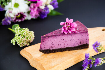 Obraz na płótnie Canvas Homemade cheesecake with fresh blueberries and mint for dessert - healthy organic summer dessert pie cheesecake. Creative atmospheric decoration