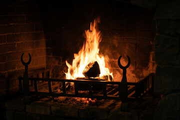 Old and antique fireplace at night.