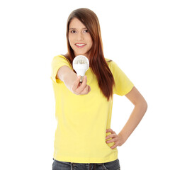 Young happy woman holding diode bulb
