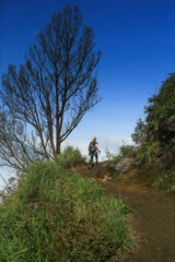 A woman walk at the top of Ijen Crater Banyuwangi East Java Indonesia
