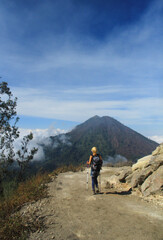 Fototapeta na wymiar A woman on the way back from Mount Ijen Banyuwangi East Java Indonesia