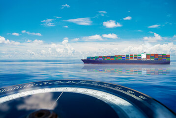 Compass and container ship, vessel, boat blue summer sea ocean day with bright sky.