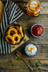 Onion rings, sauces and soda