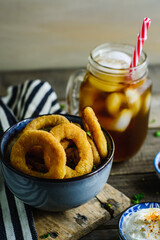 Onion rings, sauces and soda
