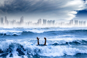 global warming and extreme weather concept. man drowning in the 