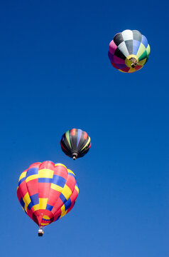 Three hot air balloons in the sky.
