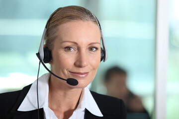 Woman smiling with headset