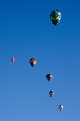 Fototapeta premium Distant hot air balloons in flight.