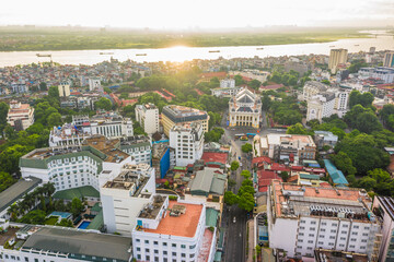 Obraz premium Aerial skyline view of Hanoi city, Vietnam. Hanoi cityscape by sunset period at August Revolution Square, with Hanoi Opera House