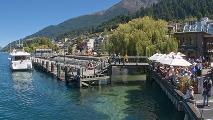 Fototapeta na wymiar Diners and Tourists at The Queenstown Jetty