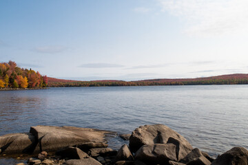 Autumnal view of a peaceful lake in the Frontenac national park, Canada