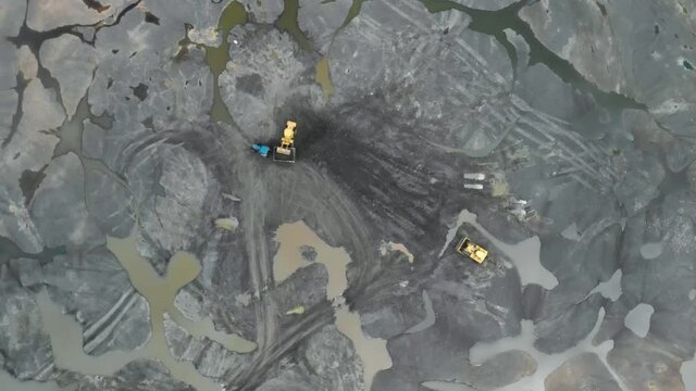 Drone view of Workers Mining on The Pitch Lake in Trinidad from above