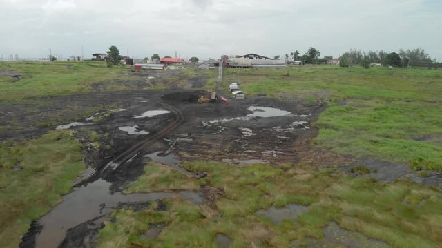 The Pitch Lake in Trinidad with trucks