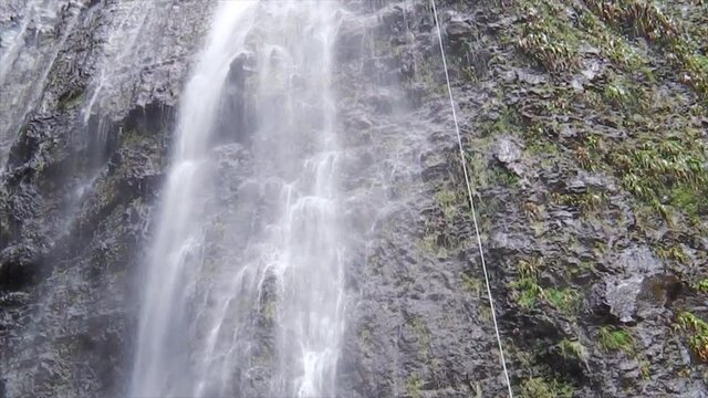Rappelling down Ravine Blance, Reunion Island's highest waterfall, over 300m.