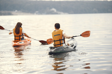 Kayaking. A women in a kayak. Girls paddling in the water.