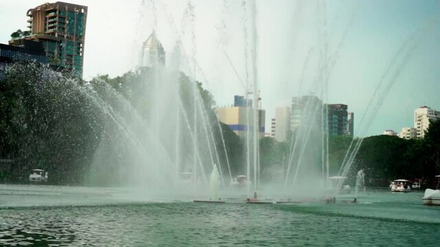 Fountain in the middle of the lake in the Lumpini park, Bangkok, slowmotion 120fps