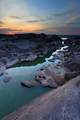Sunrise of sampanbok (3000 Hole), The Amazing of Rock in Mekong River, Ubon Ratchathani, Thailand