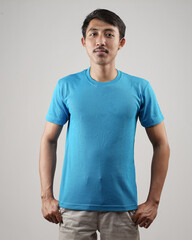 Young men in empty blue T-shirts, stylish and posing like famous T-shirt models. Men's t-shirt template and mockup design for print. photo shoot models isolated white background.