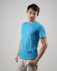 Young men in empty blue T-shirts, stylish and posing like famous T-shirt models. Men's t-shirt template and mockup design for print. photo shoot models isolated white background.