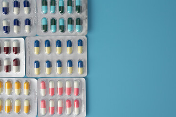 medical pills and tablets drug antibiotics capsule pills Pharmaceutical medicament top view. Space...