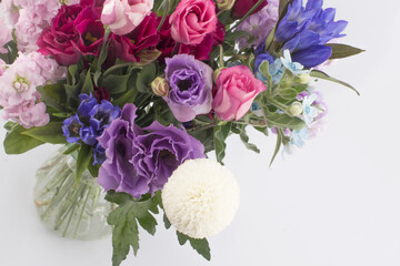 Beautiful pink, purple Lisianthus bouquet in full bloom with green leaves.