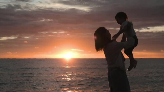 A golden family sunset beach walk