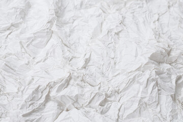 Obraz premium Crumpled white paper background.
