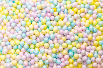 Purple, yellow, blue plastic balls.