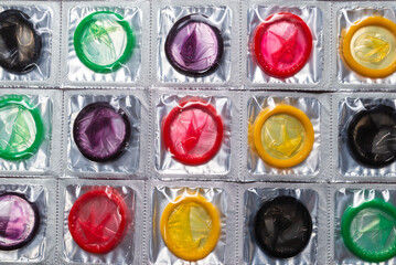 Colorful condoms background.