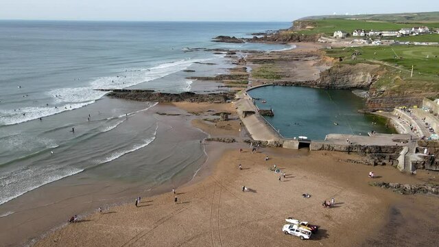 Bude Sea Pool done flys over beach people swimming lifeguards on duty