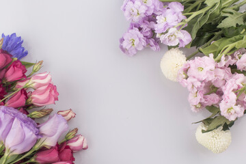 bouquet of pink and violet lisianthus flowers on white background.